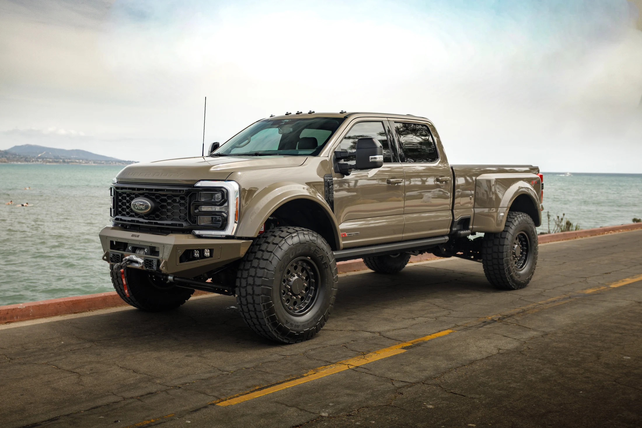 A crew-cab Truman photographed along the coast.